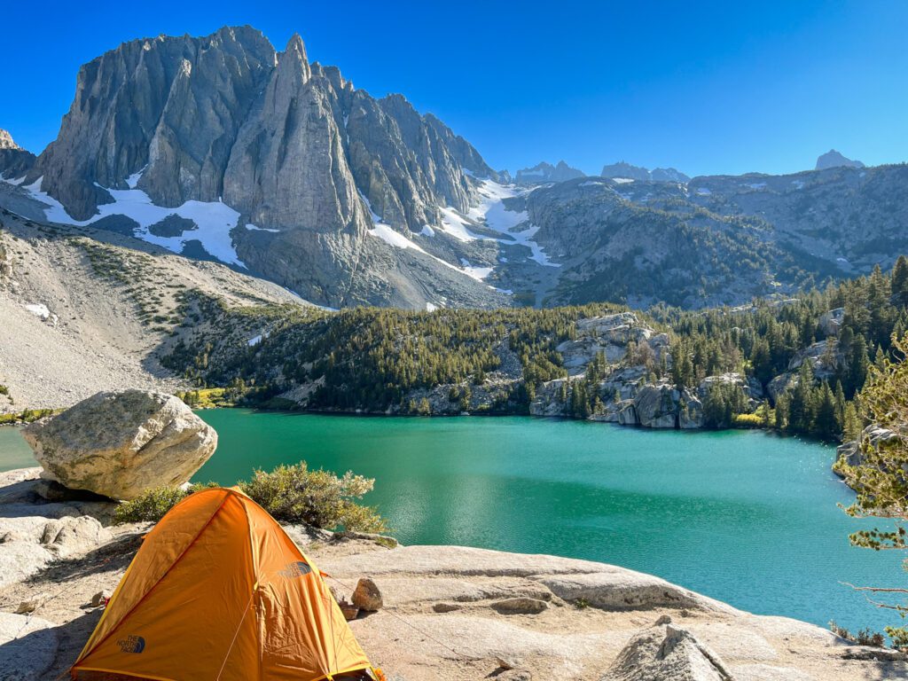backpacking setup at big pine lakes with a camping tent overlooking an alpine lake