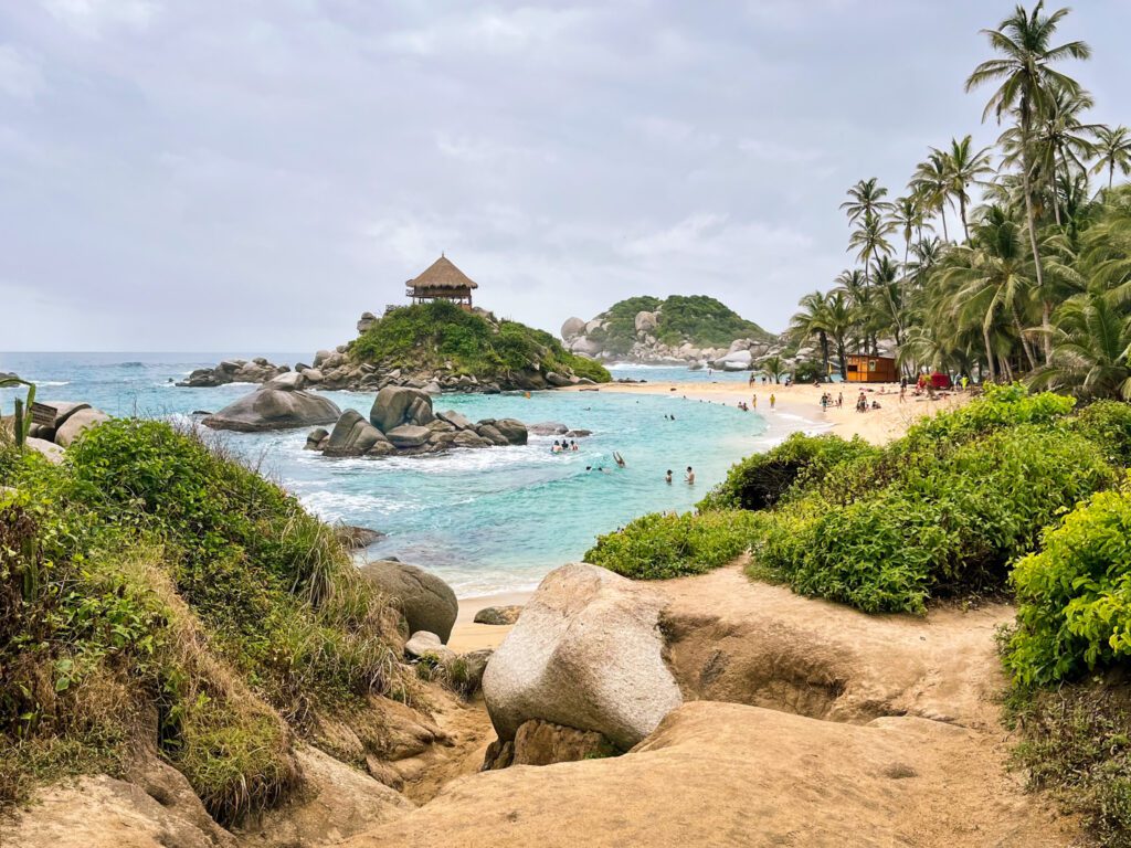 a tropical beach with turquoise water in Tayrona National Park