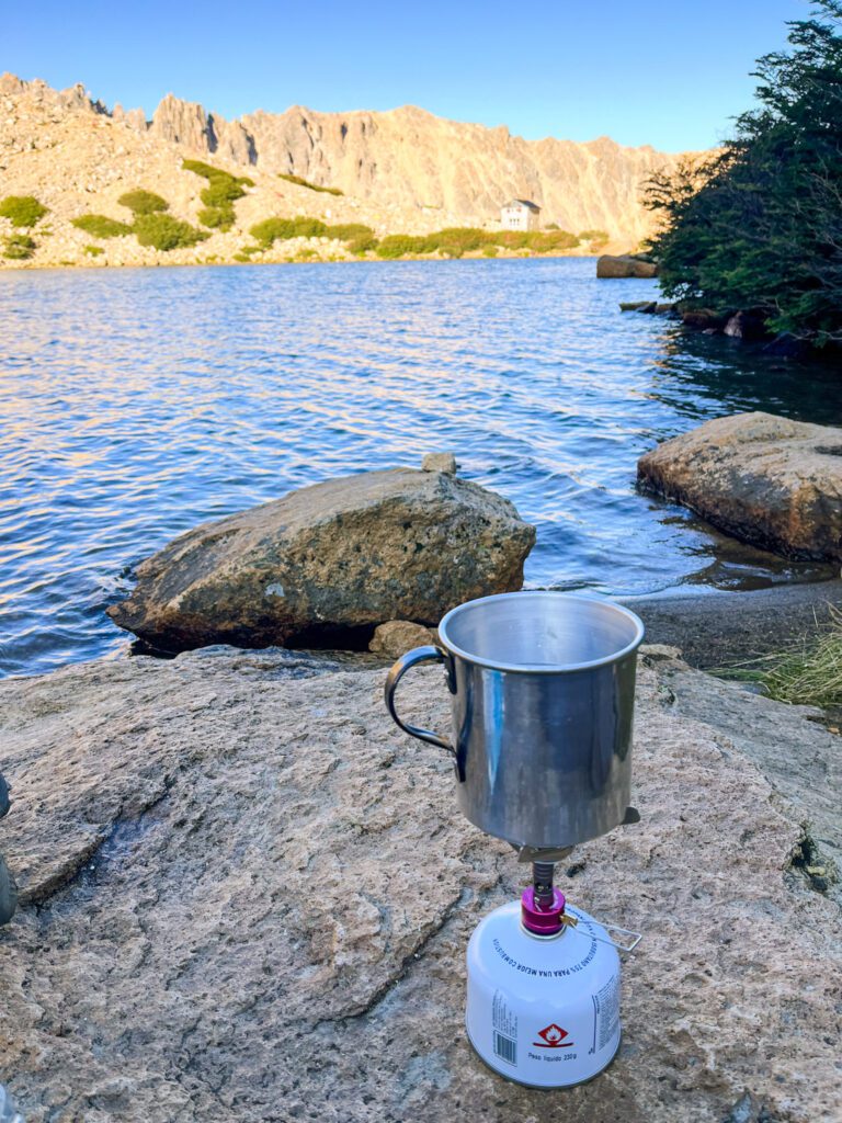 backpacking cooking equipment next to a lake