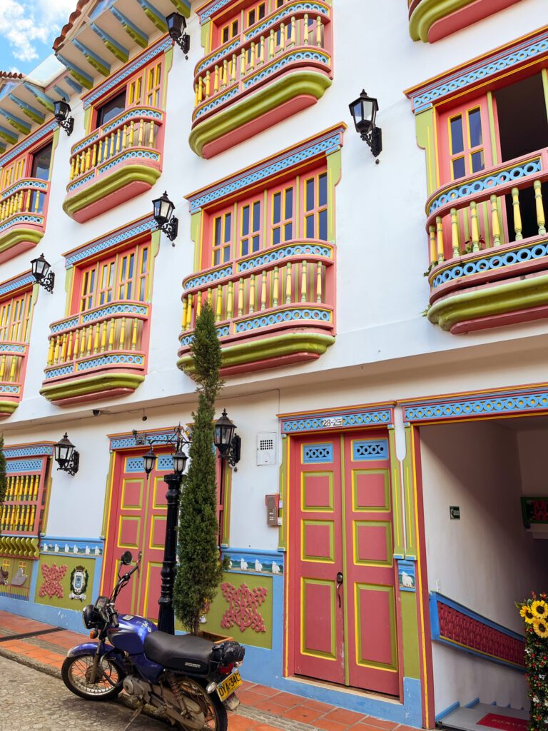 a colorful colonial building in guatape, colombia