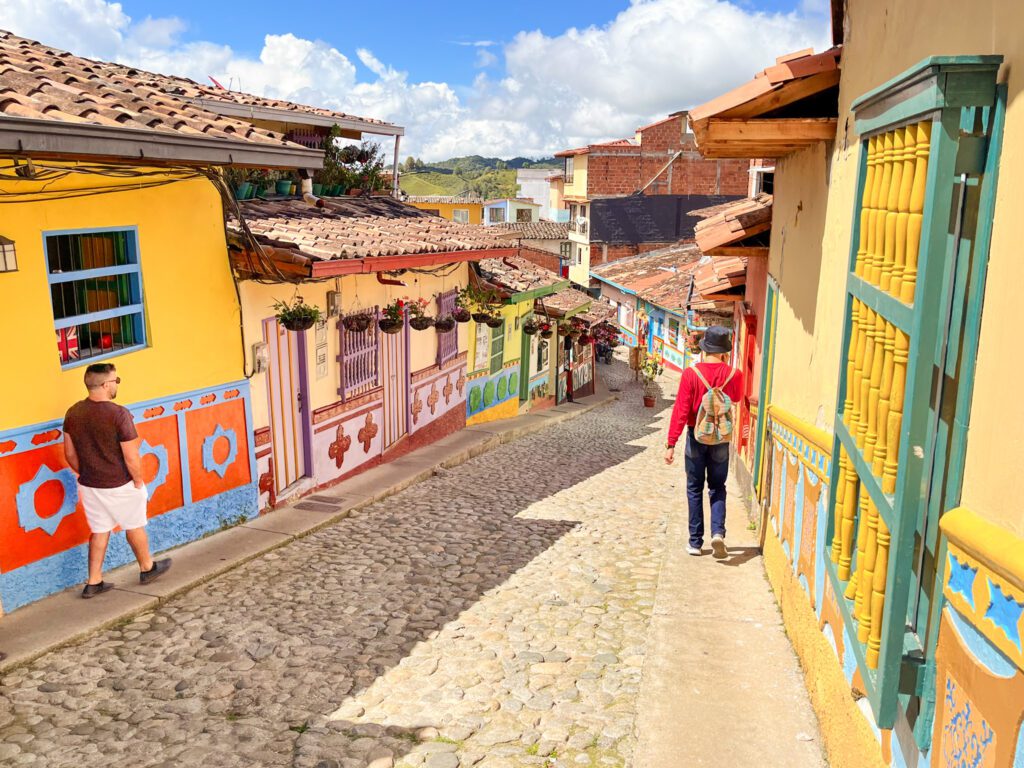 a colorful street in a colonial town in colombia
