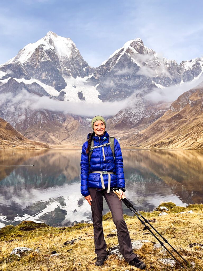 A solo female traveler hiking in the mountains