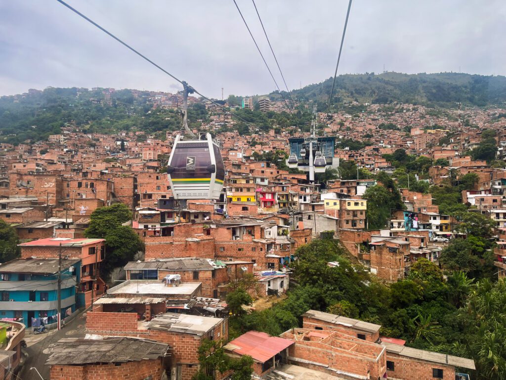 cable cars above a hilly neighborhood in medellin, colombia
