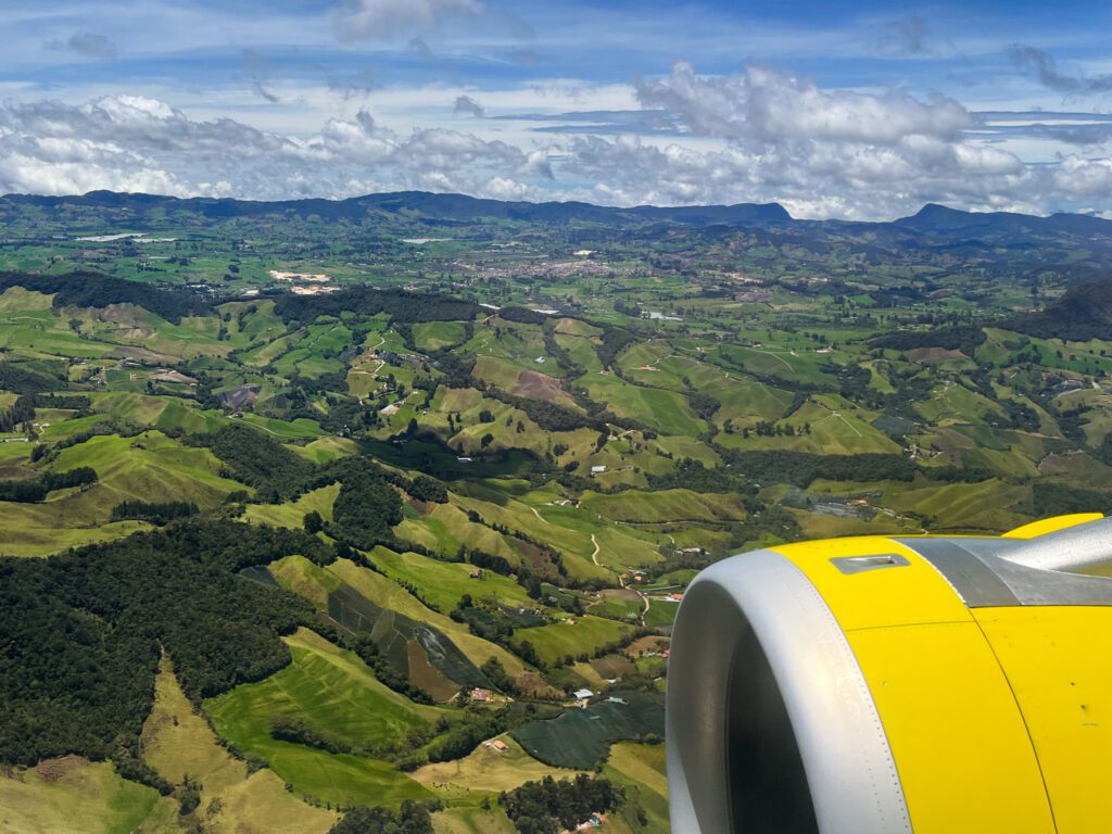 an aerial view of the green hills of medellin