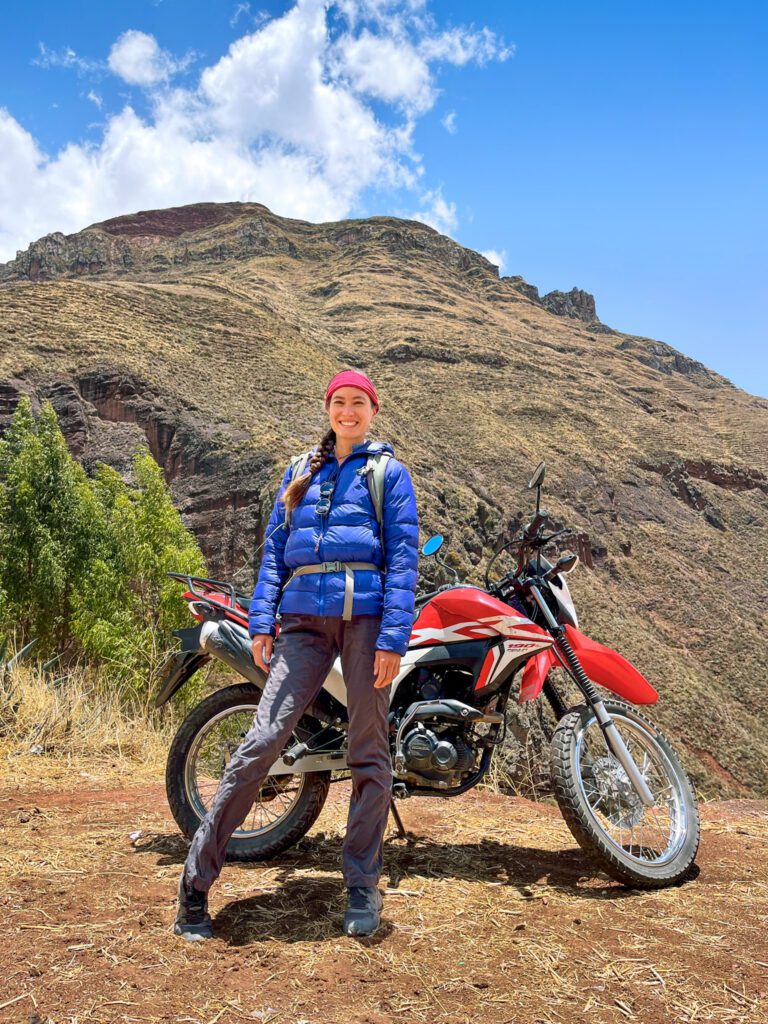 traveler next to a motorcycle