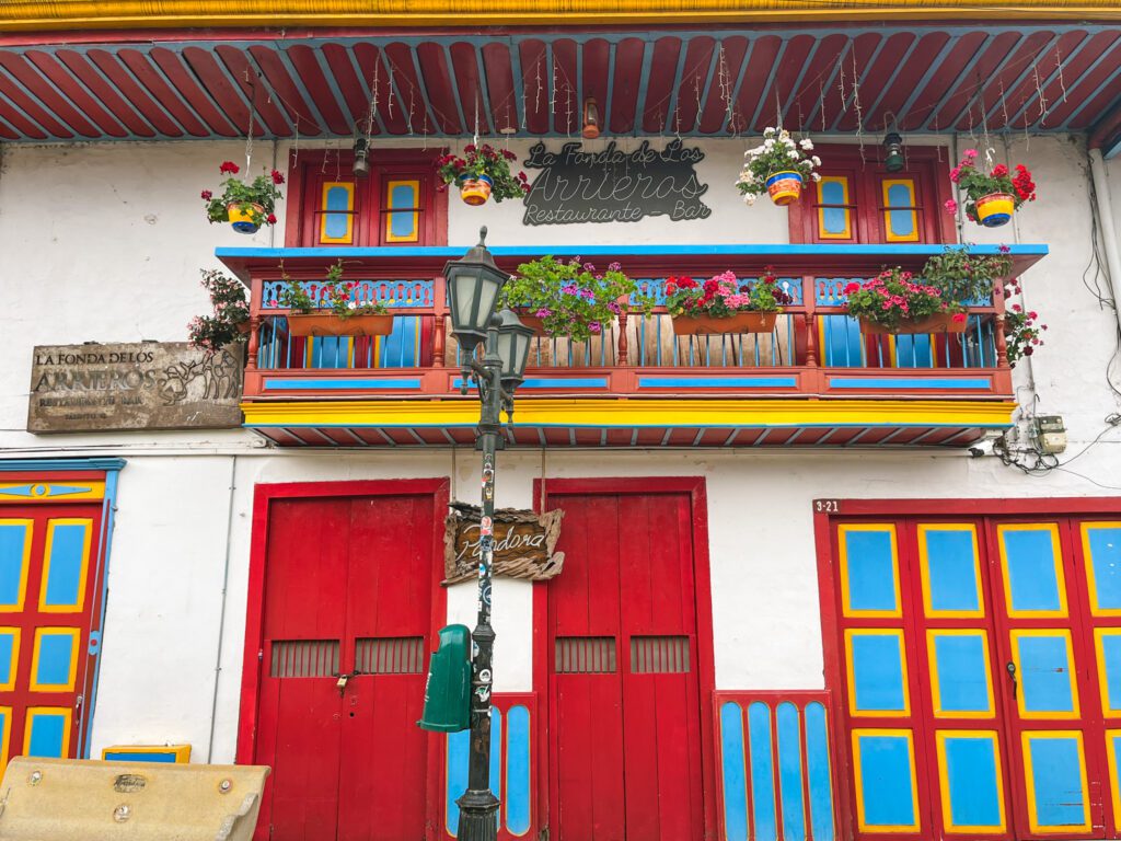 a colorful building in a colonial town in colombia