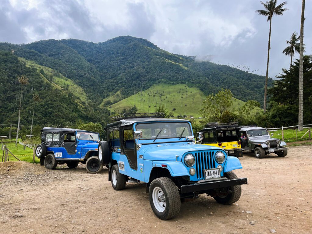 colorful jeeps in valle de cocora, colombia