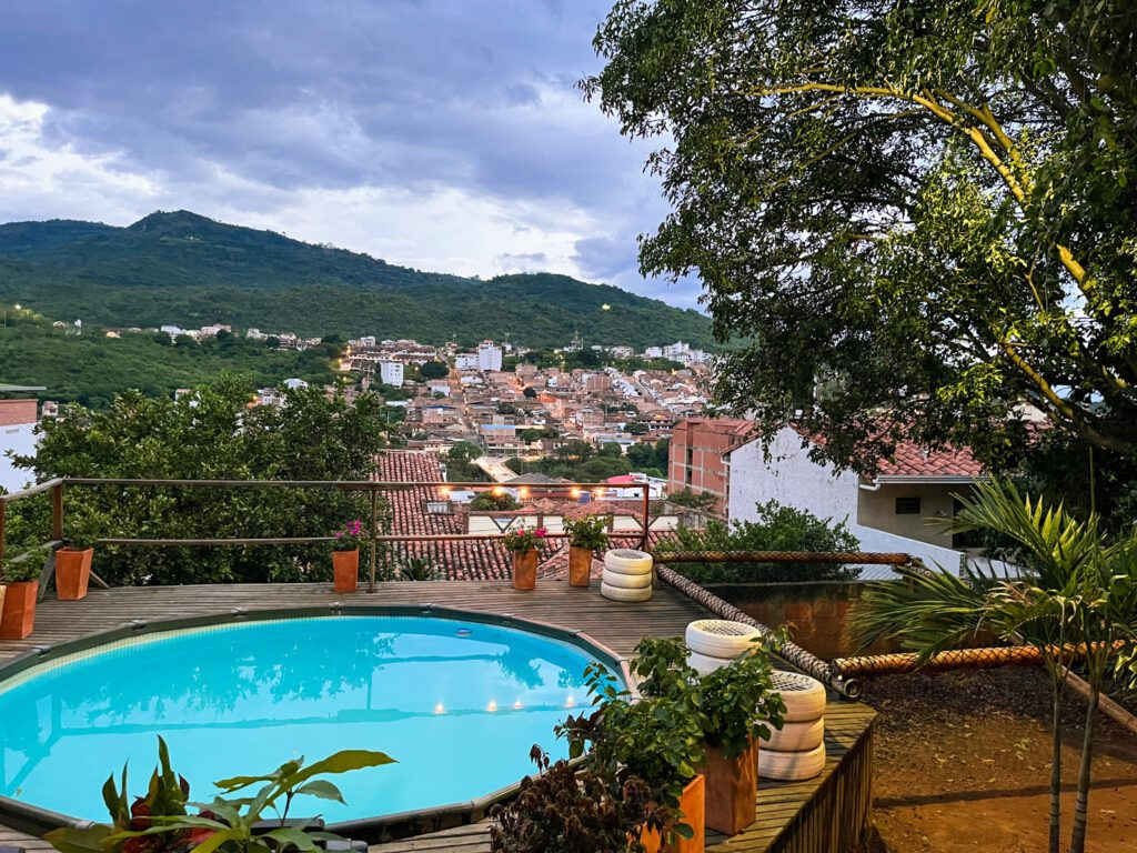 a hostel pool overlooking the mountain town of san gil, colombia