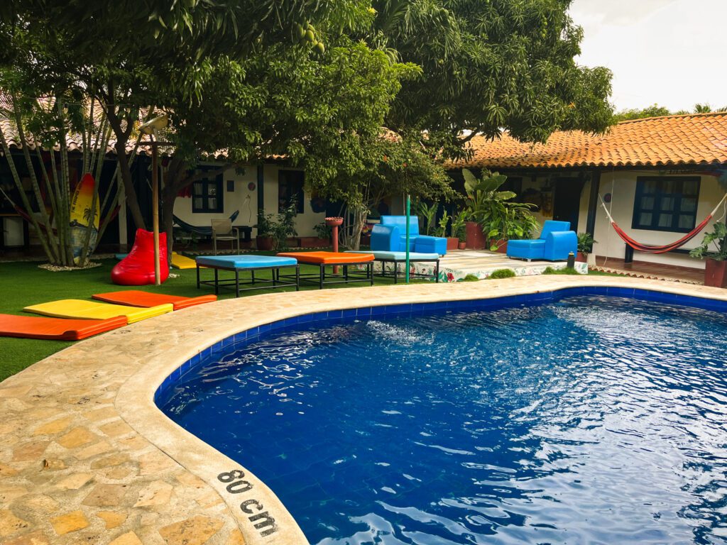 a courtyard with a pool at a hostel in santa marta, colombia