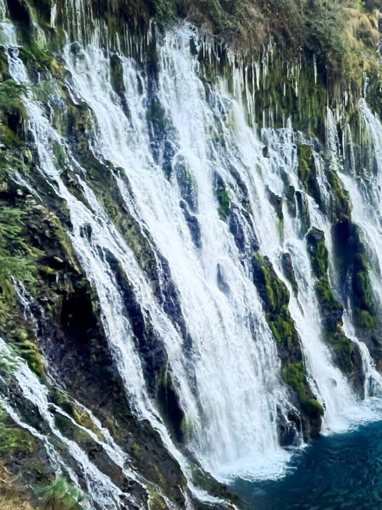close-up view of individual streams of water of a waterfall in california