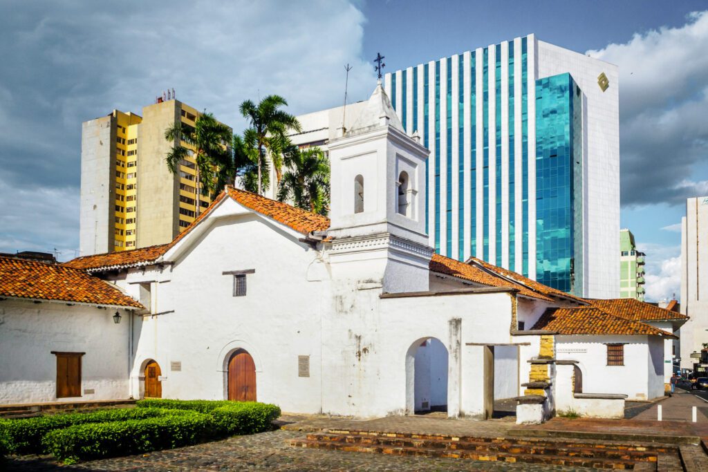 a church next to modern buildings