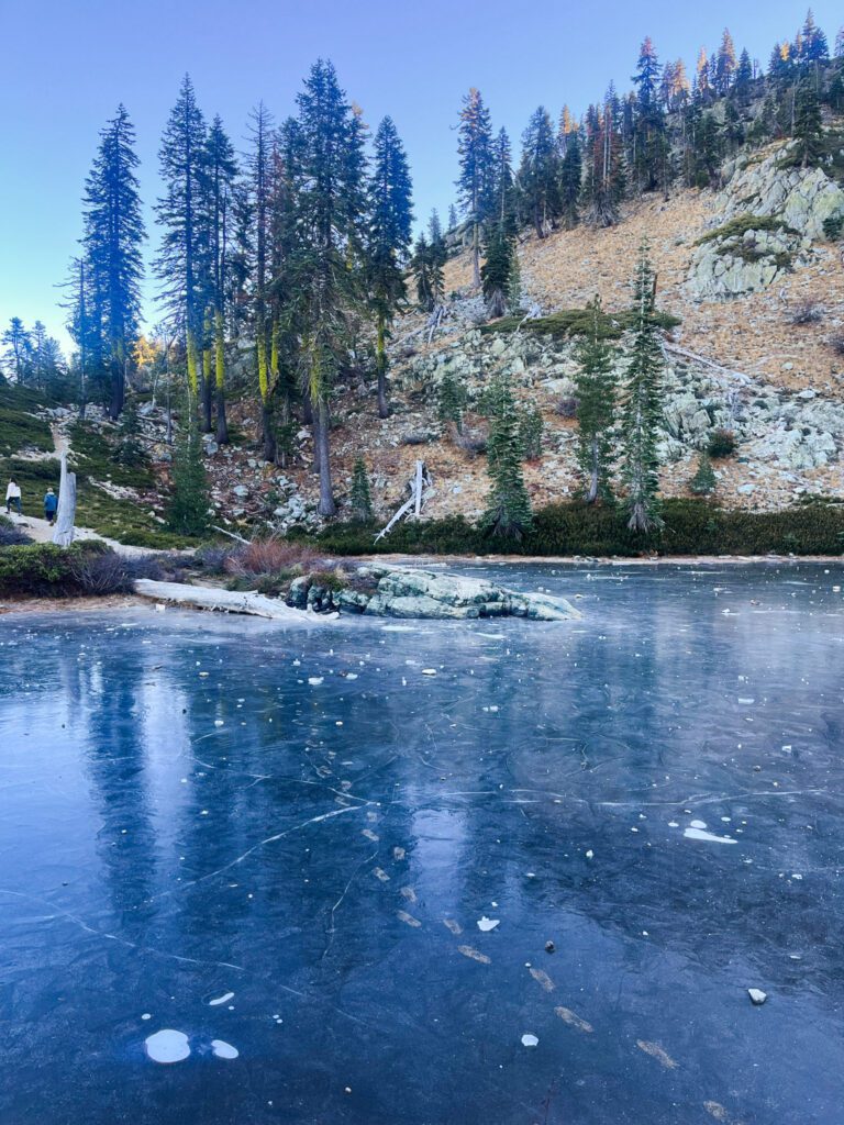 a frozen lake with footprints across it
