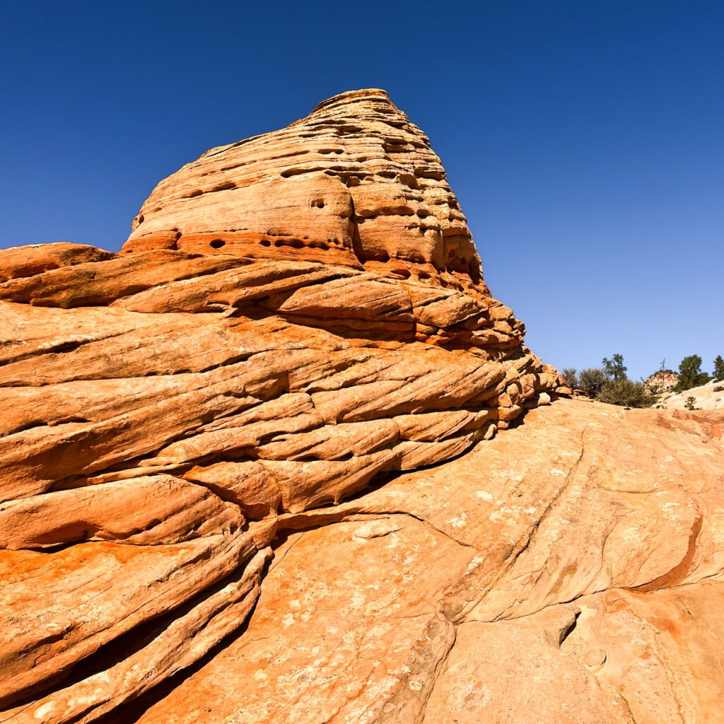a sandstone formation with a striped pattern