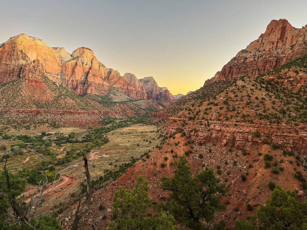 a view from a hiking trail overlooking a canyon in zion national park in utah
