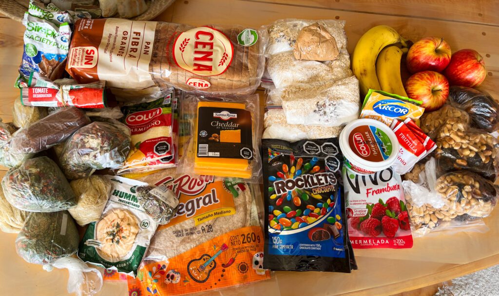 a spread of backpacking foods prepared in individual bags.