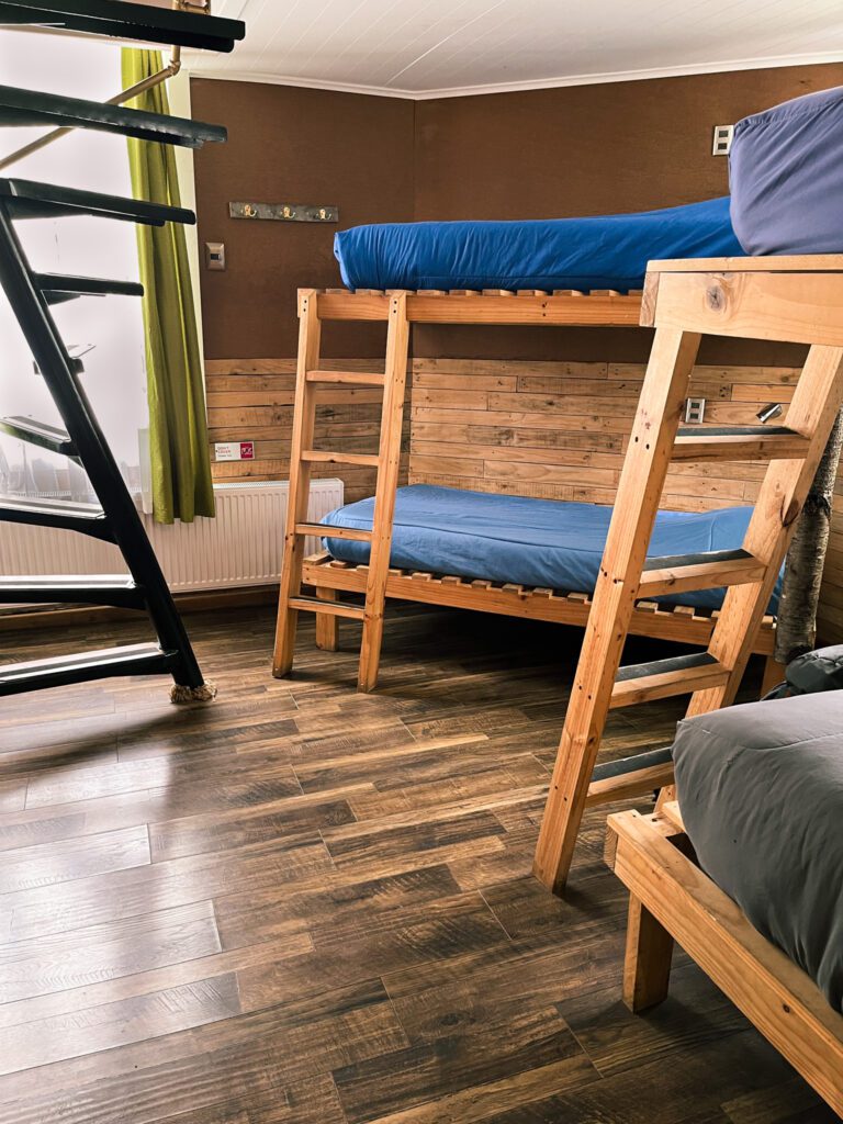 a hostel room with bunk beds