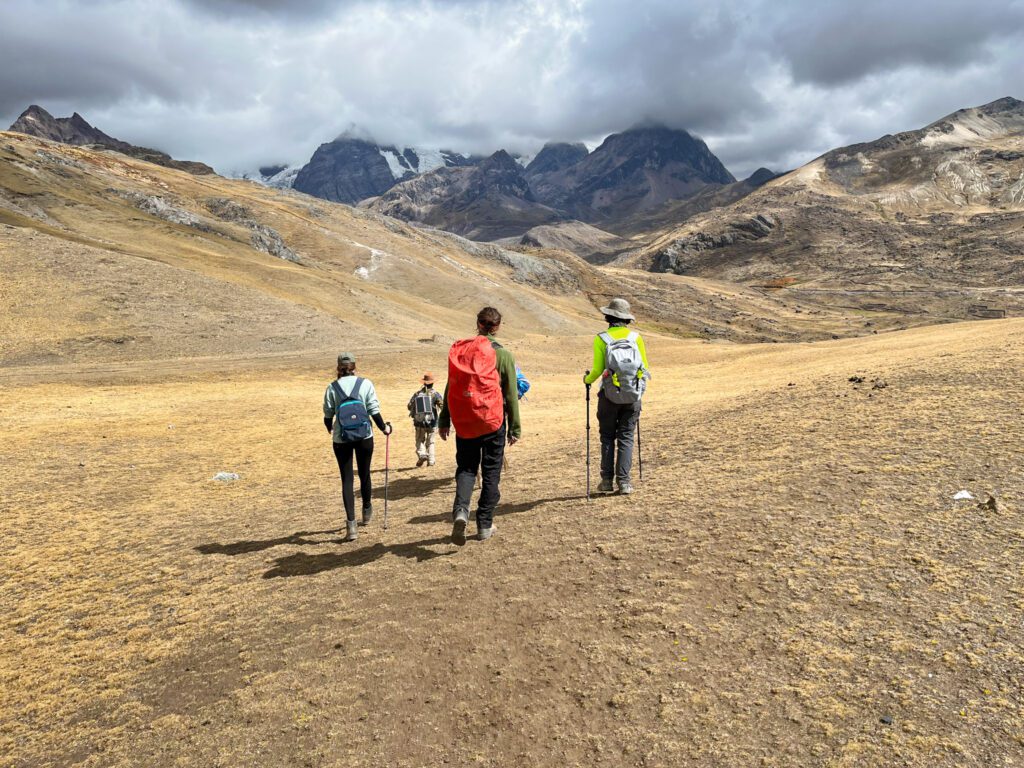a group of hikers walking through the mountains