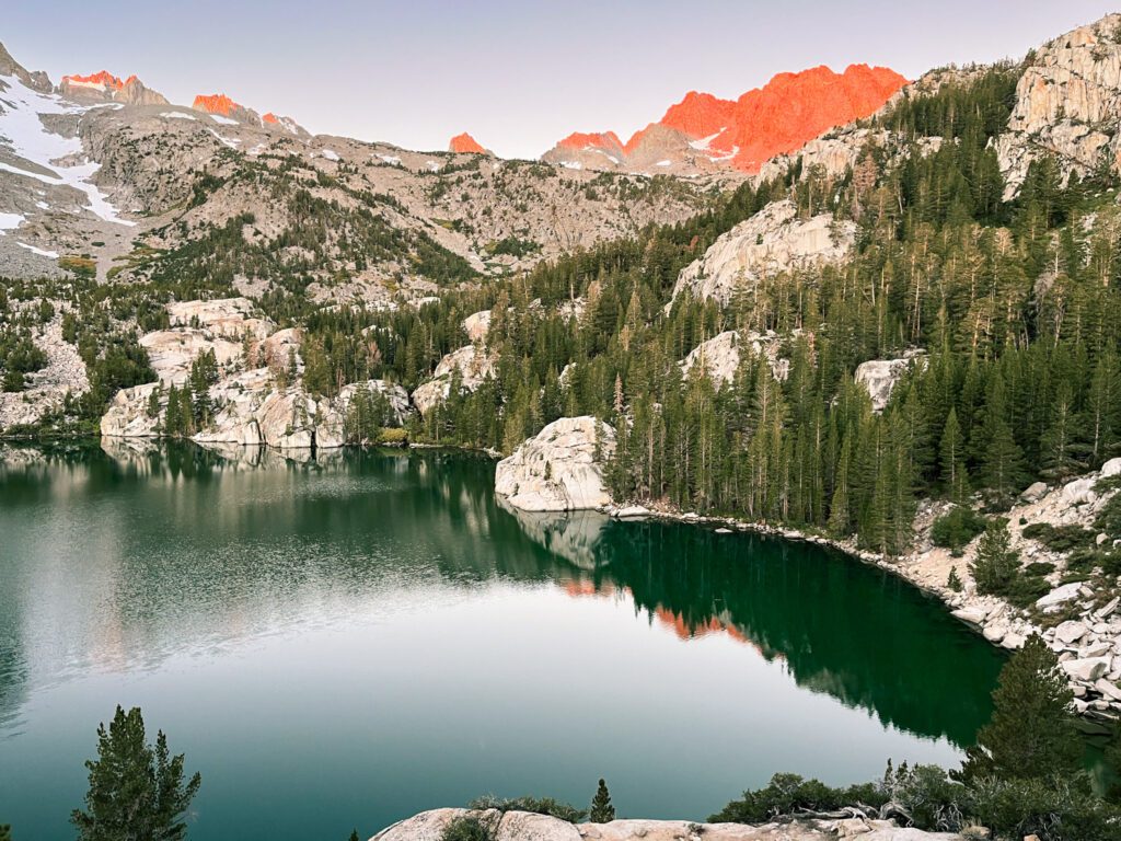 Alpenglow during sunrise at Second Lake on the Big Pine Lakes trail.
