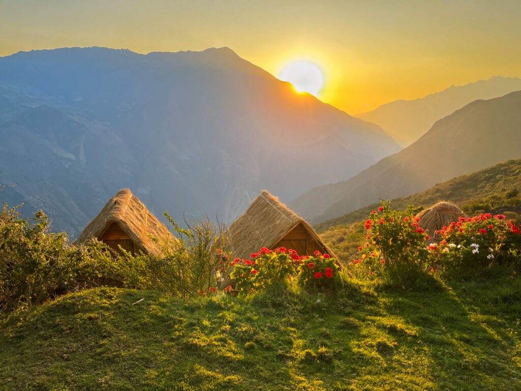 sunset at a mountain village that offers some of the best backpacking meals to hikers.