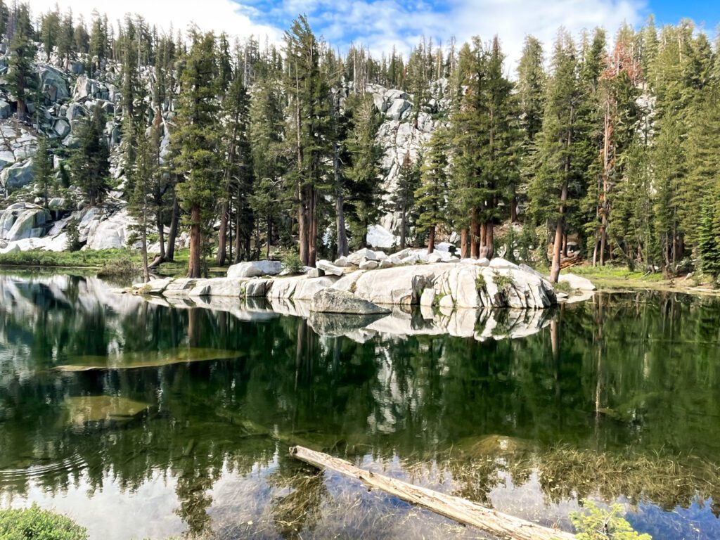 a deep green alpine lake on the lakes trail to pear lake in sequoia national park