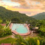 an infinity pool overlooking the mountains at sunset in minca, colombia