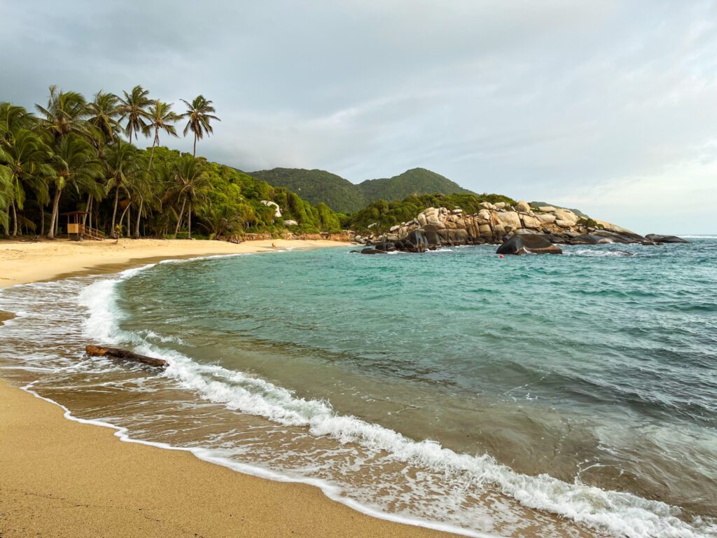 a tropical beach in colombia, where travelers are recommended to get vaccinations to ensure a safe visit
