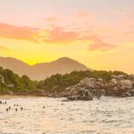 a sunset on the beach in colombia