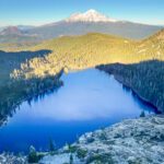 an aerial view of castle lake from the heart lake trail near mt shasta
