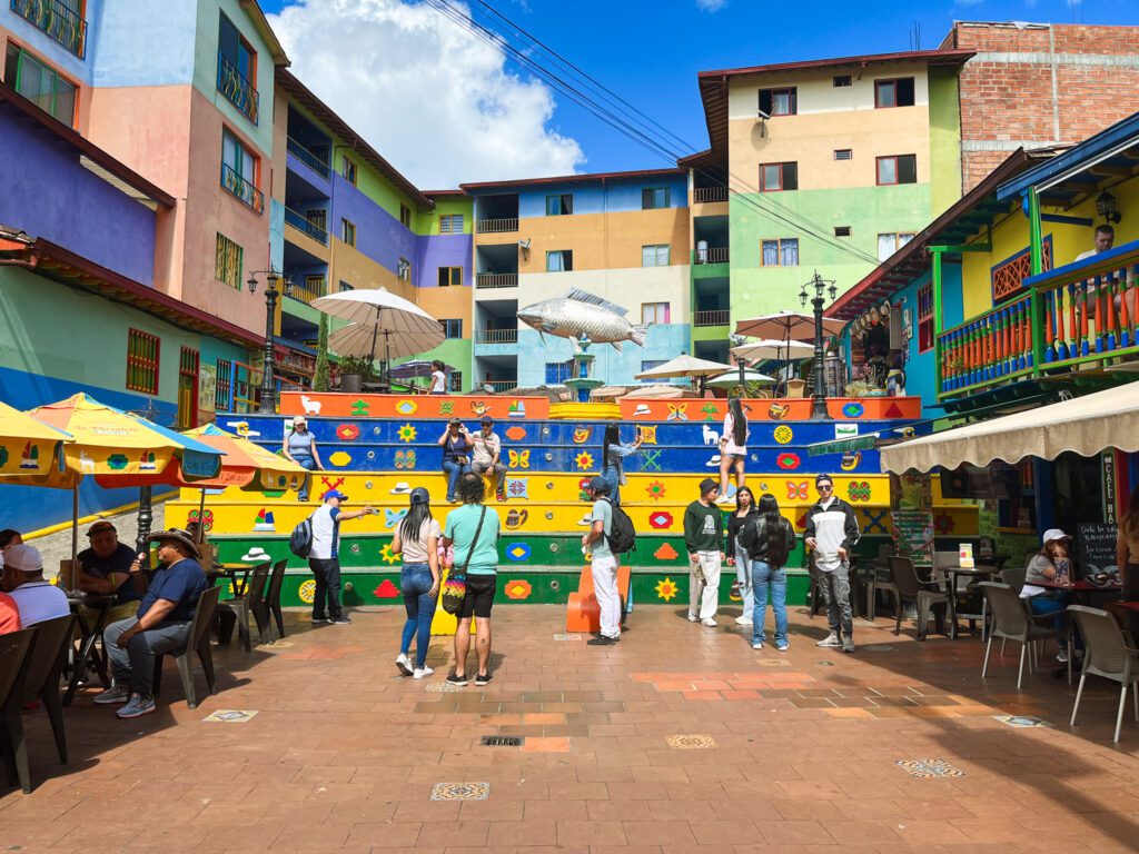 a colorful plaza in the colonial town of guatape, colombia