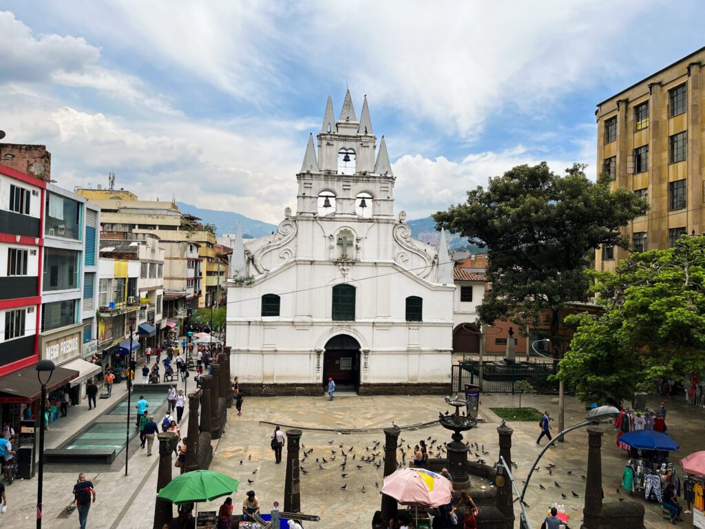 a white church in the city center of medellin, colombia