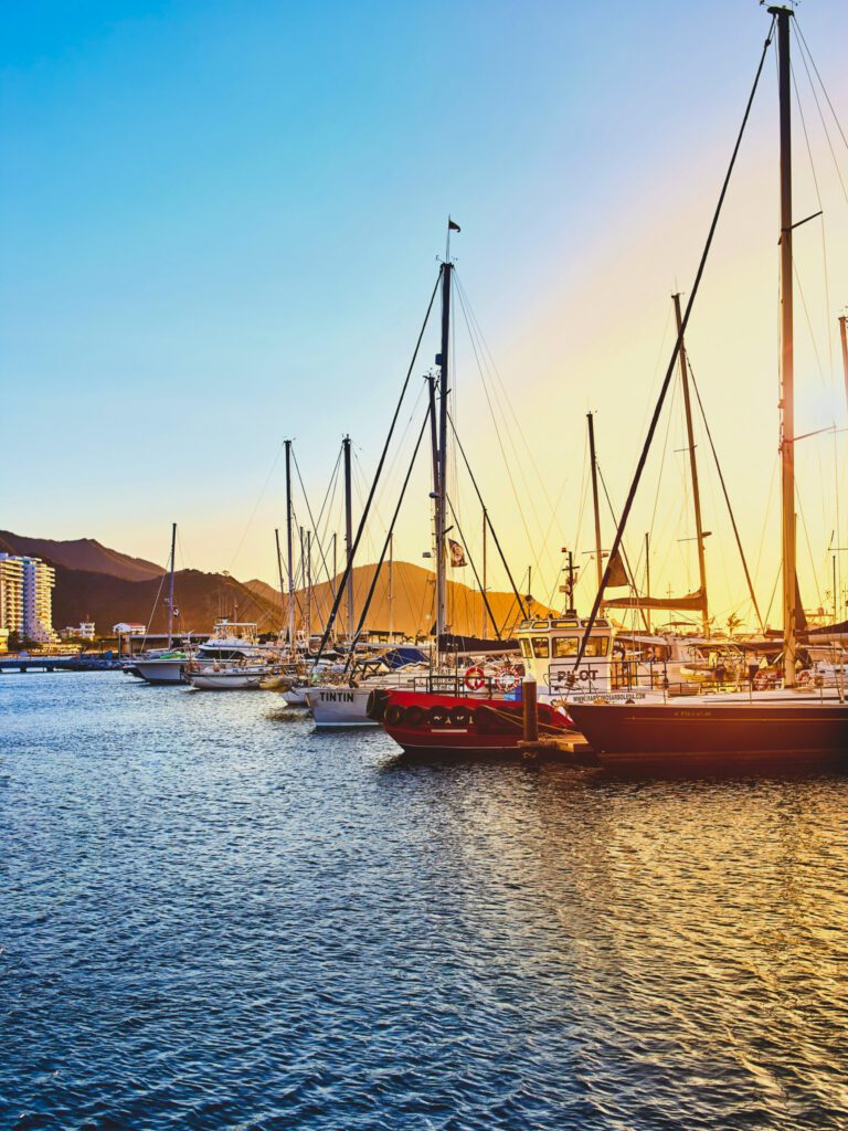 boats docked in the marina of santa marta, colombia during sunset