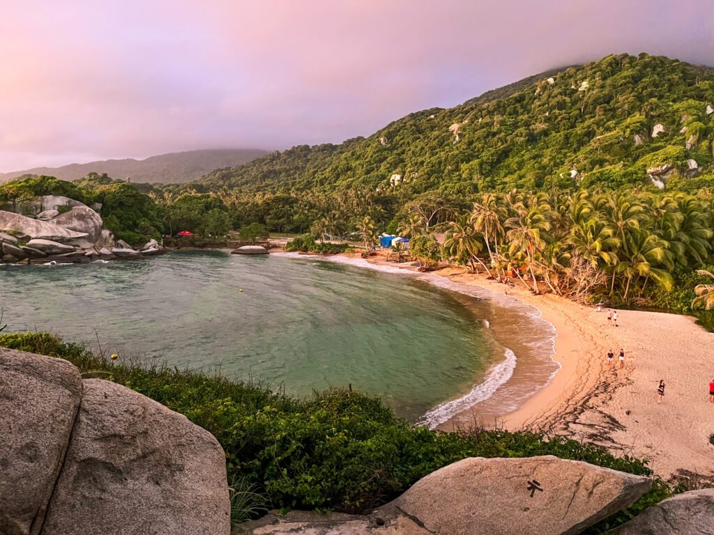 a tropical beach in a protected cove during sunrise
