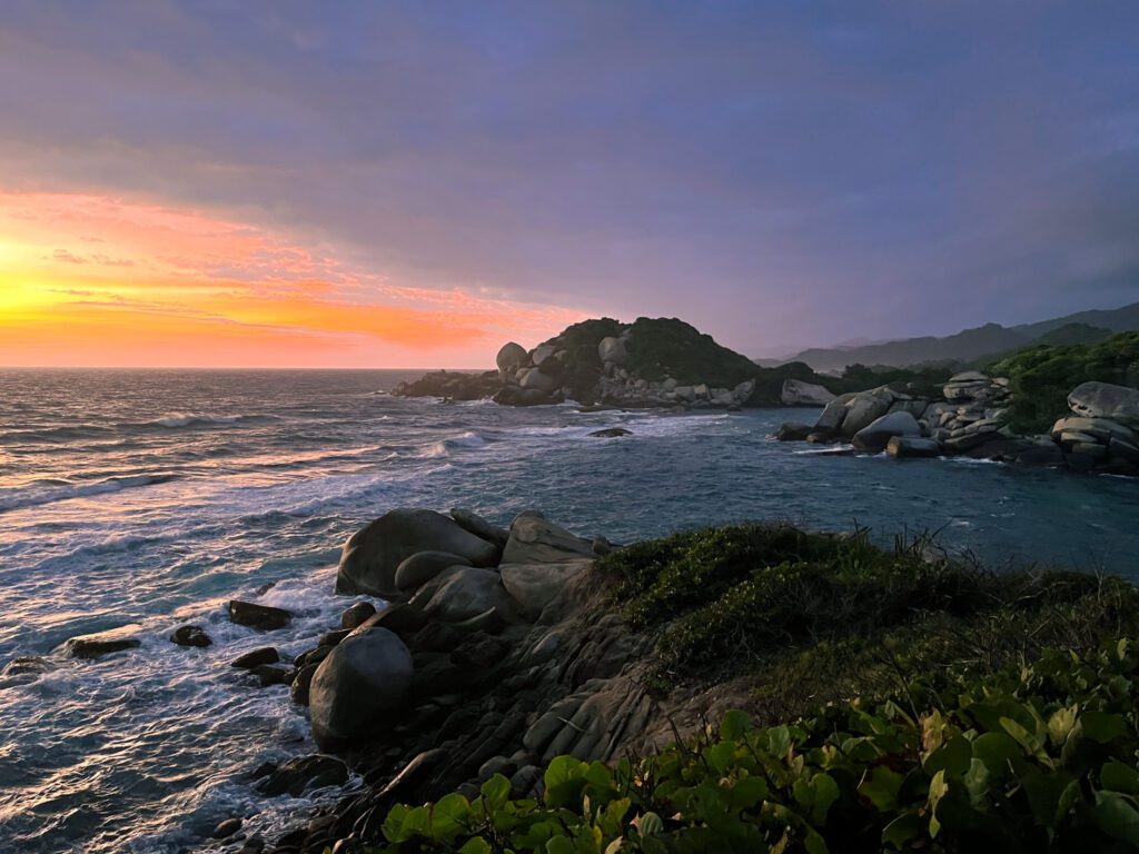sunrise over the water at tayrona national park in colombia
